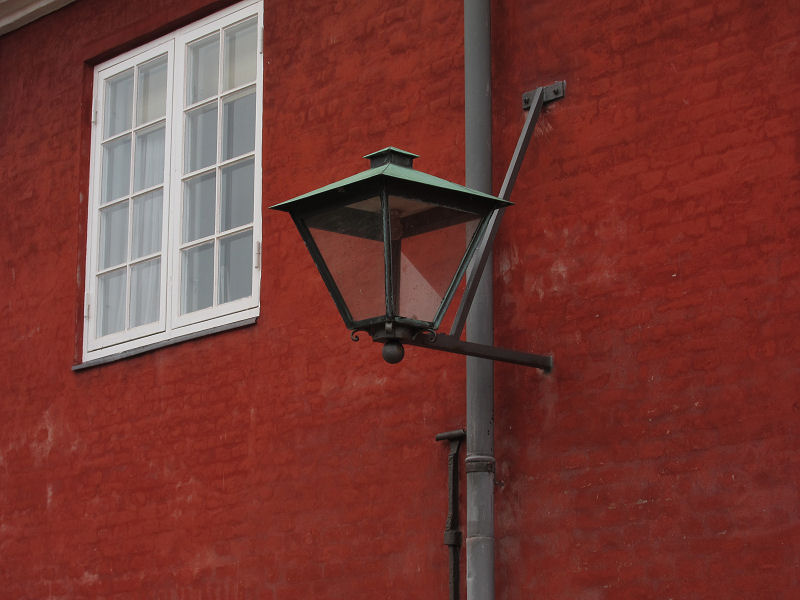 09_window_lamp_gutter_and_wall_in_the_fort.jpg